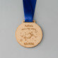 Kobieta nie z tej ziemi - Drewniany medal