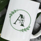 Monogram w kole kwiaty - kubek personalizowany