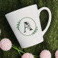 Monogram w kole kwiaty - kubek personalizowany